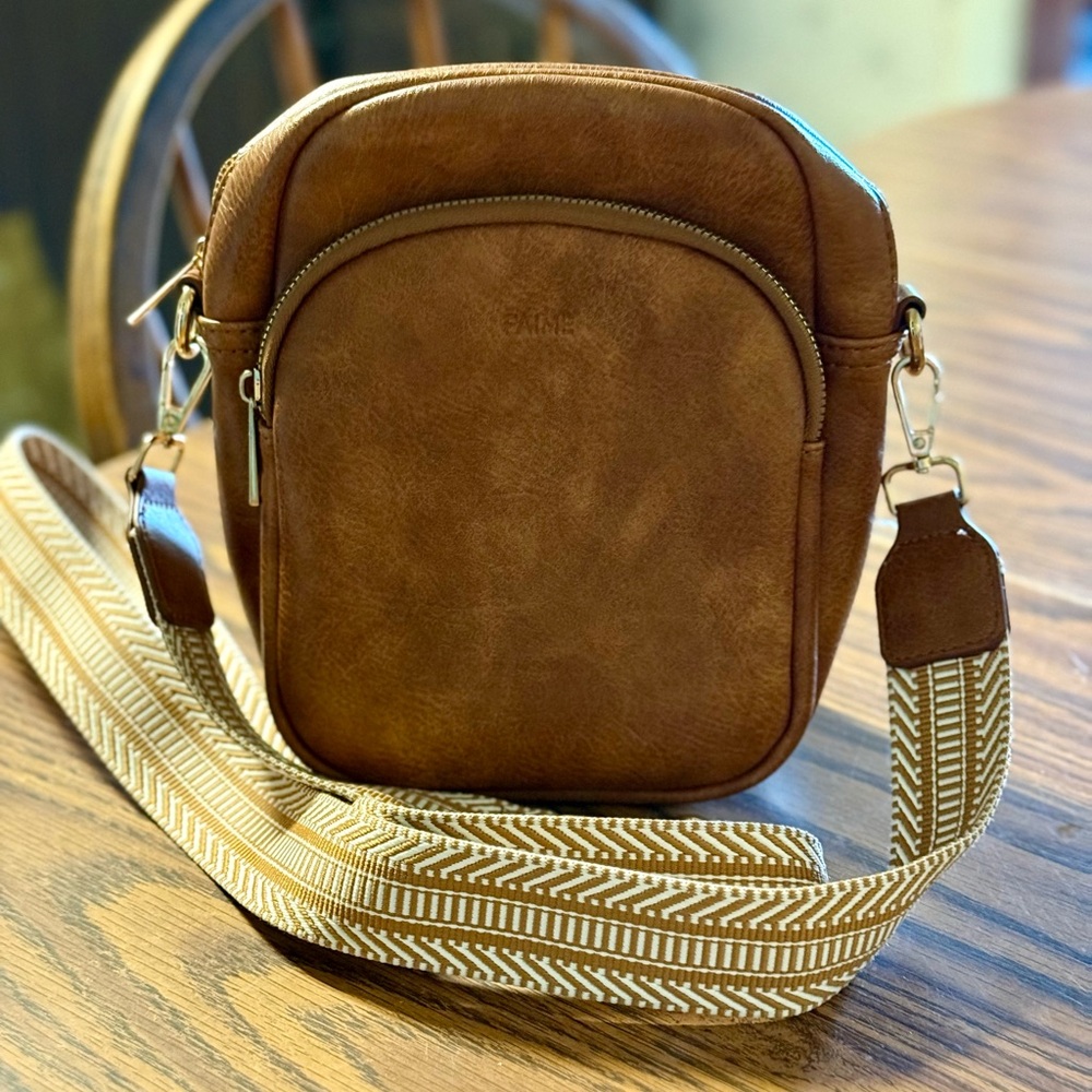Brown Crossbody Bag with Adjustable Woven Strap and Metal Hardware